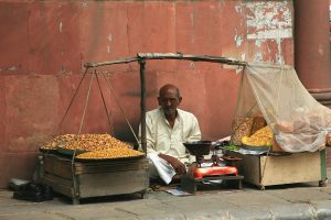 a street vendor on a footpath in india
